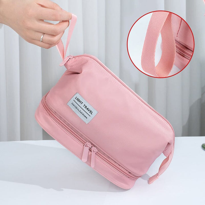 Black waterproof travel toiletry bag, front view of its sleek design, emphasizing its unisex appeal and portability.