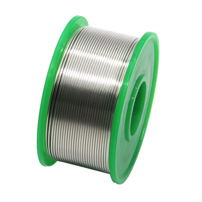 Technician's hand holding lead-free solder wire near a small electronic circuit, precision work.