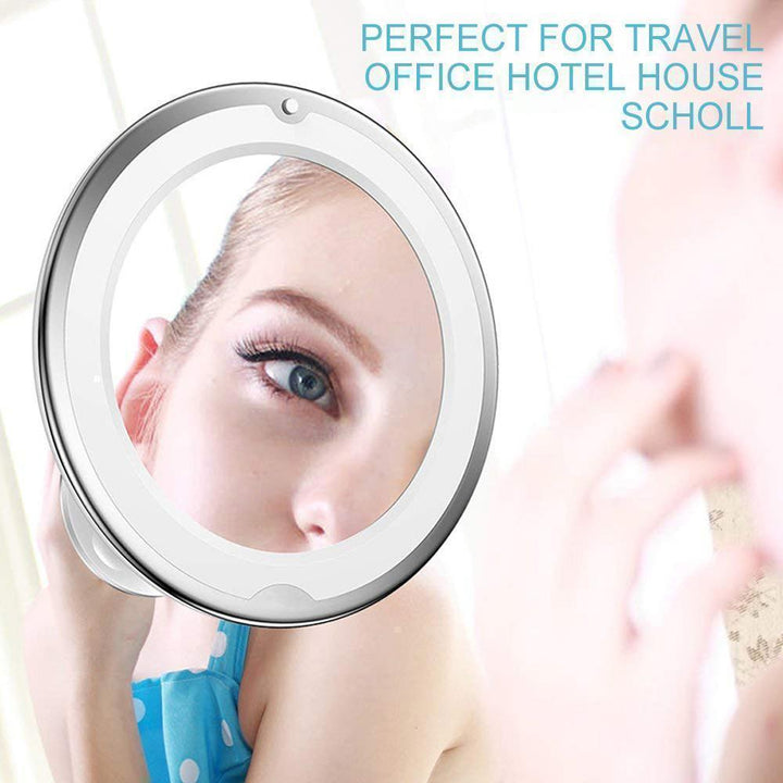 Portable LED makeup mirror featuring 10x magnification and a strong suction cup base