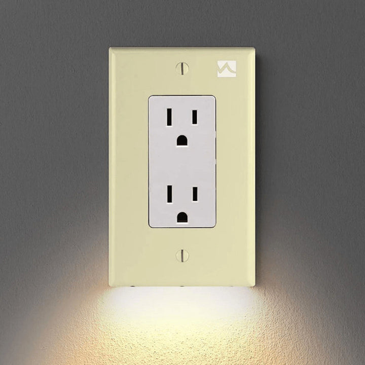Discreet LED night light outlet cover plate for hallways, providing soft light that won't disrupt sleep