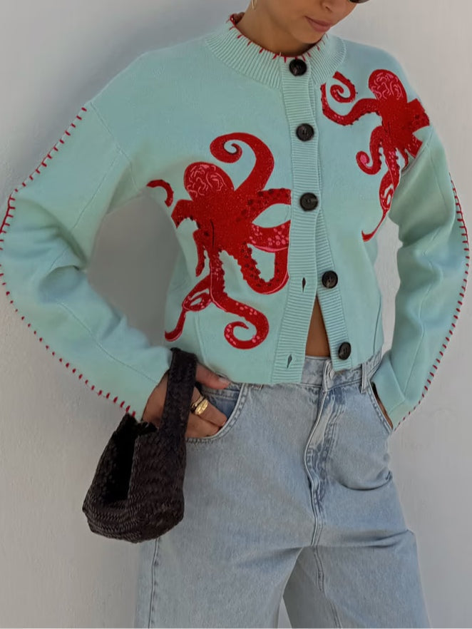 Stylish women's light blue knit cardigan featuring a unique octopus design.