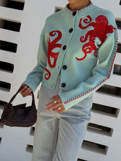 Knit women's cardigan, light blue, with a distinctive octopus pattern & button-front closure.