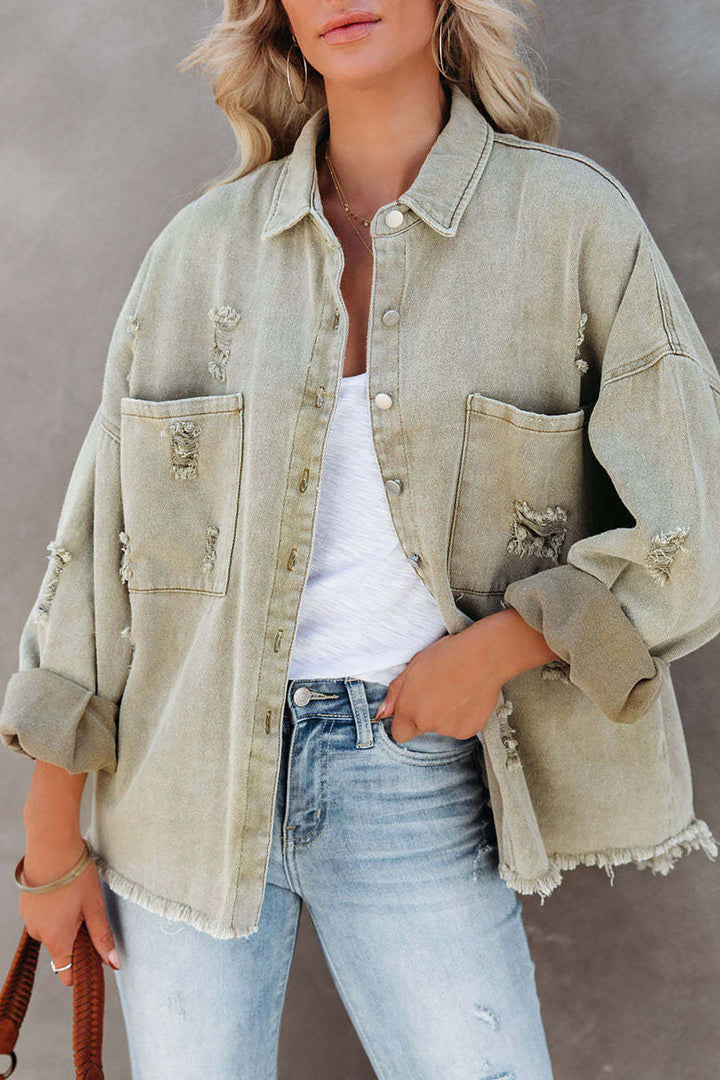 Light green oversized distressed denim jacket for women. Trendy spring/summer style.