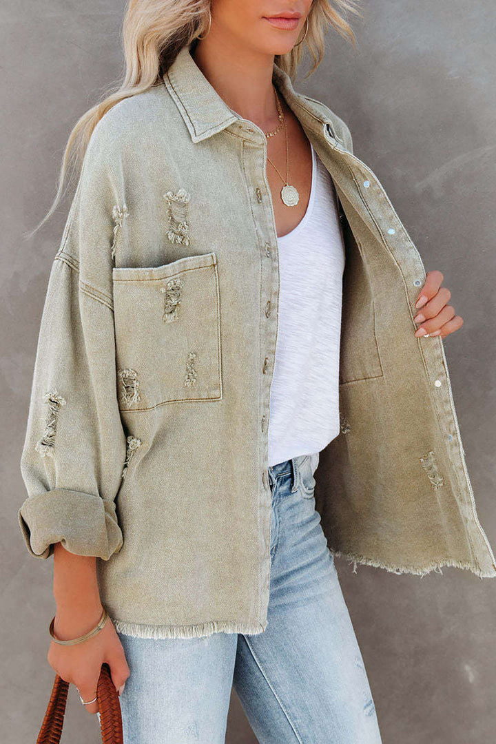 Chic women's light green distressed denim jacket, oversized for effortless casual spring fashion.