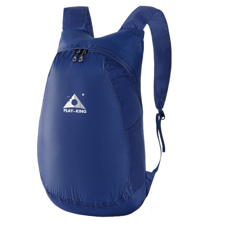 Compact folded travel bag, space-saving lightweight 20L daypack, water-resistant for easy packing.