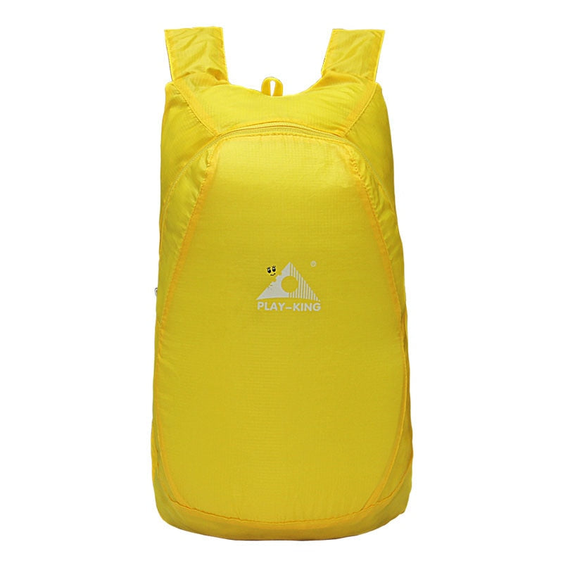 Commuter with a unisex 20L travel daypack, lightweight, foldable, and water-resistant for daily essentials.