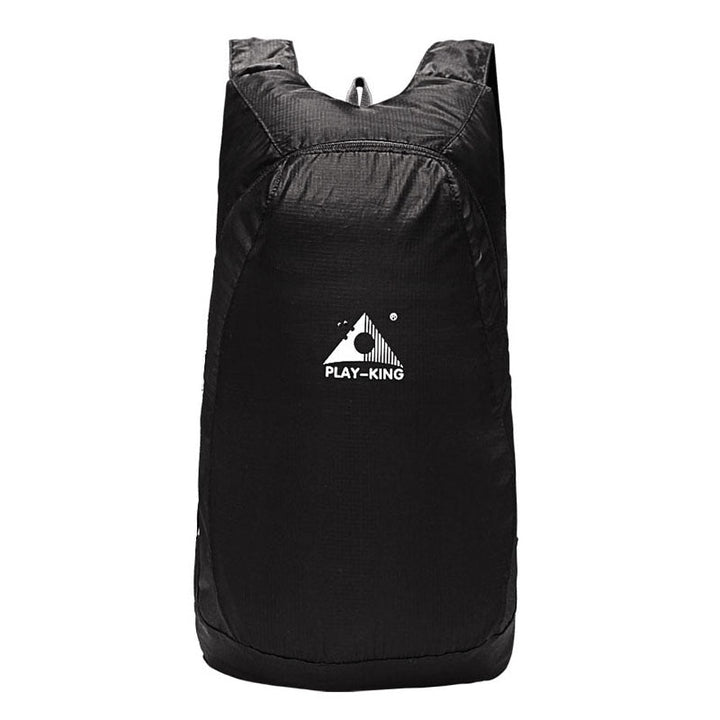 Durable water-resistant fabric on a lightweight 20L foldable travel backpack, perfect for outdoor gear.
