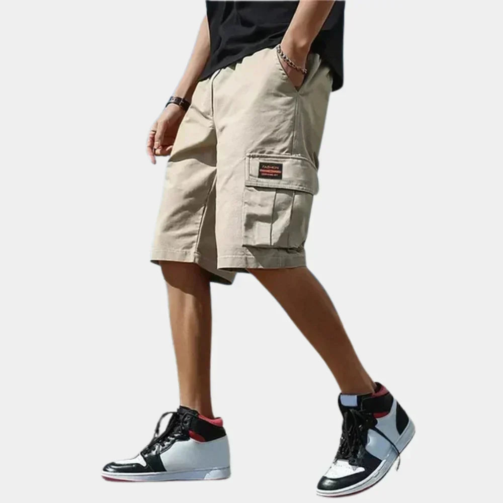 Lightweight men's cargo shorts for summer adventures, featuring a relaxed fit & practical pockets.
