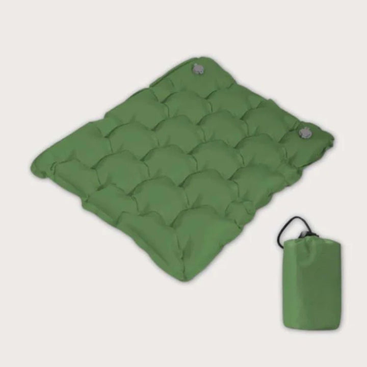 Portable inflatable seat cushion for camping. Enjoy lightweight, waterproof comfort on your outdoor adventures.