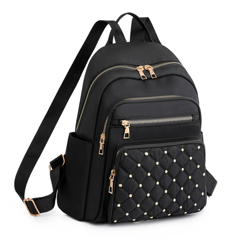 Lightweight water-resistant nylon backpack for women, ideal for travel, school, and daily commute.
