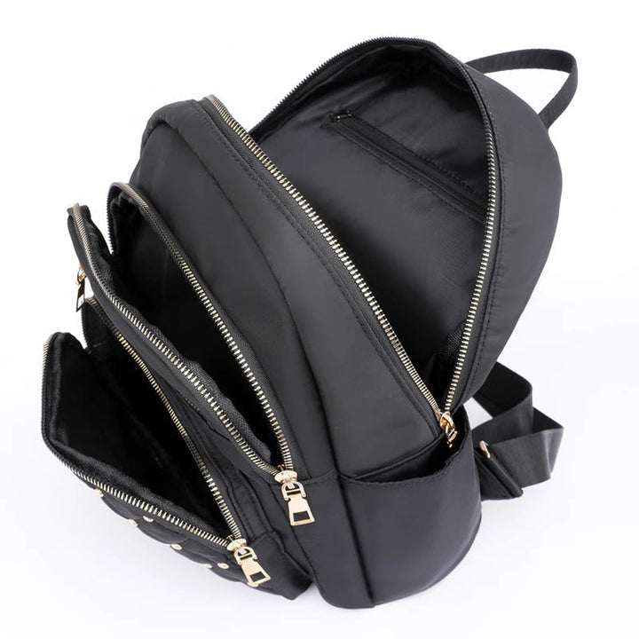 Chic lightweight nylon backpack for women, comfortable for school, travel, or daily commutes, water-resistant.