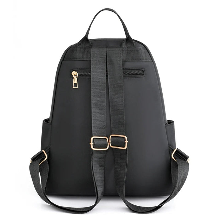 Practical women's travel backpack, lightweight and water-resistant nylon for easy packing & adventures.