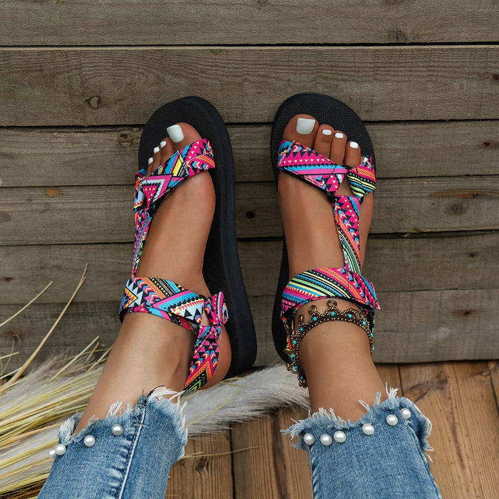 Women's lightweight colorful flat sandals for summer. Comfortable slip-on, ideal casual beach footwear.