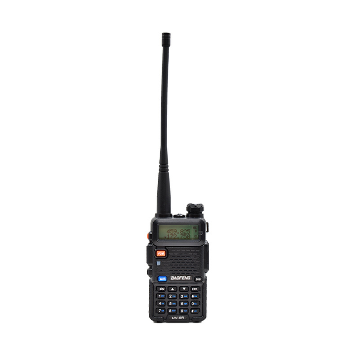 User operating a portable radio in a natural setting, showcasing real-world use for hiking