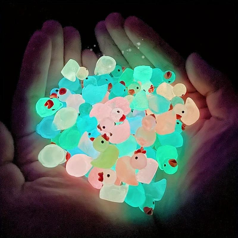 Hand holding a glow-in-the-dark miniature duck, showcasing its luminous quality for craft gifts.