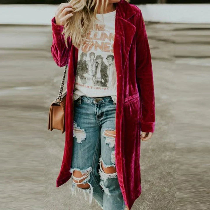 Chic velvet duster coat, long & flowing, perfect for autumn layering.