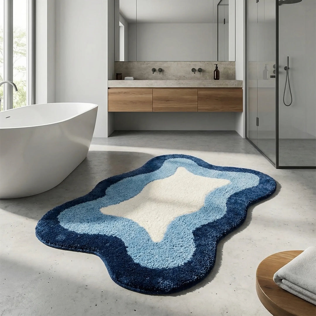 Luxury Flowique bath rug with elegant wave pattern. Plush, non-slip, and absorbent for bathroom decor.