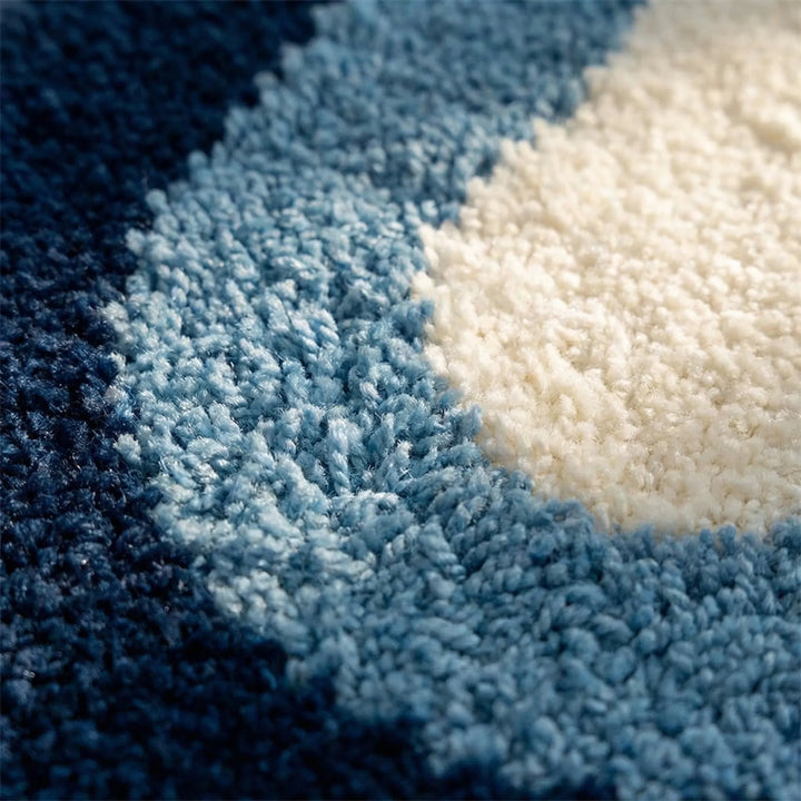 Plush and absorbent Flowique wave bath rug. A luxury non-slip statement area rug for modern home decor.