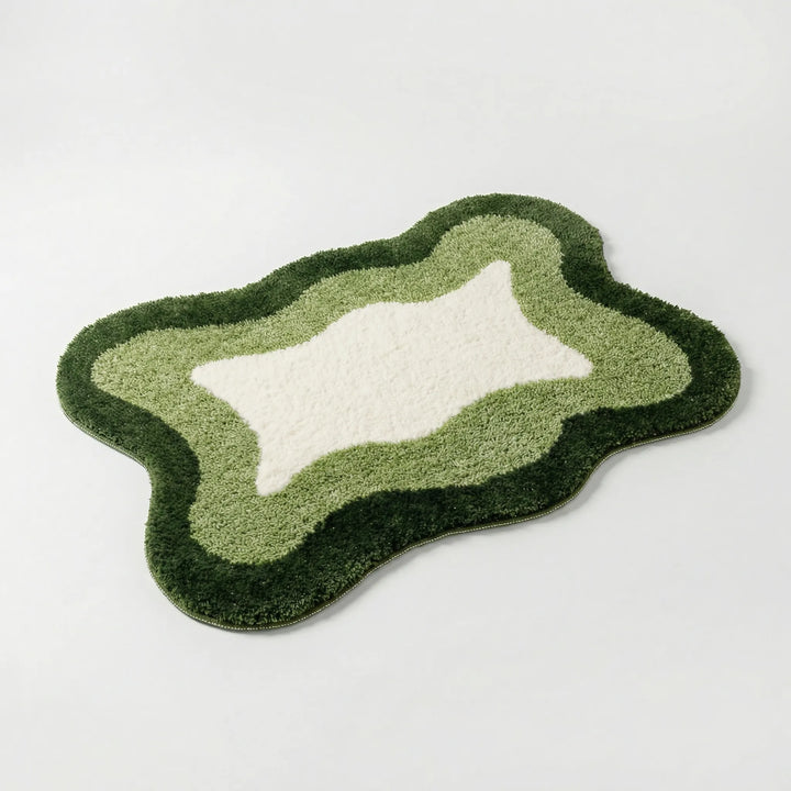 Stylish Flowique wave bath rug, a luxurious non-slip floor mat for upscale bathroom or elegant bedroom home decor.