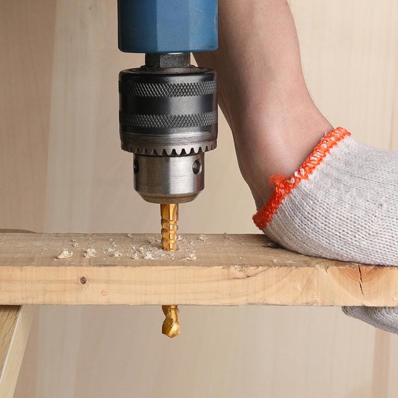 Hand holding a single M35 Cobalt HSS titanium drill bit, ready for metalworking projects