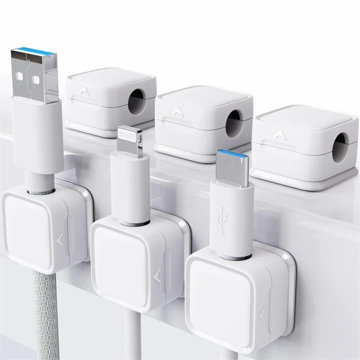 High-angle shot of a magnetic wire holder organizing multiple thin cables on a modern desk