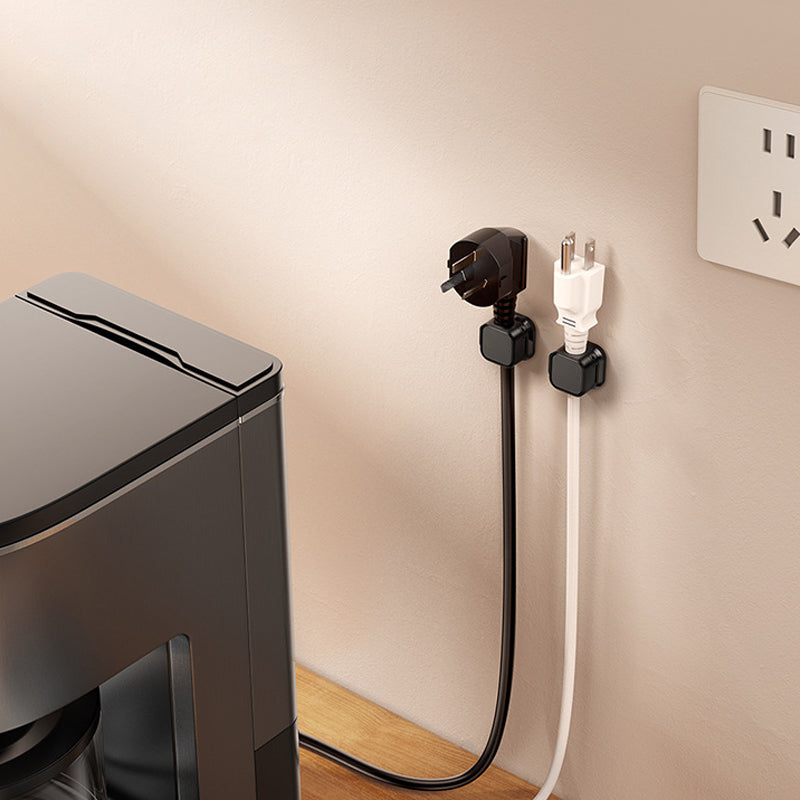 Under-desk view showcasing magnetic cable clips effectively hiding and organizing computer wires