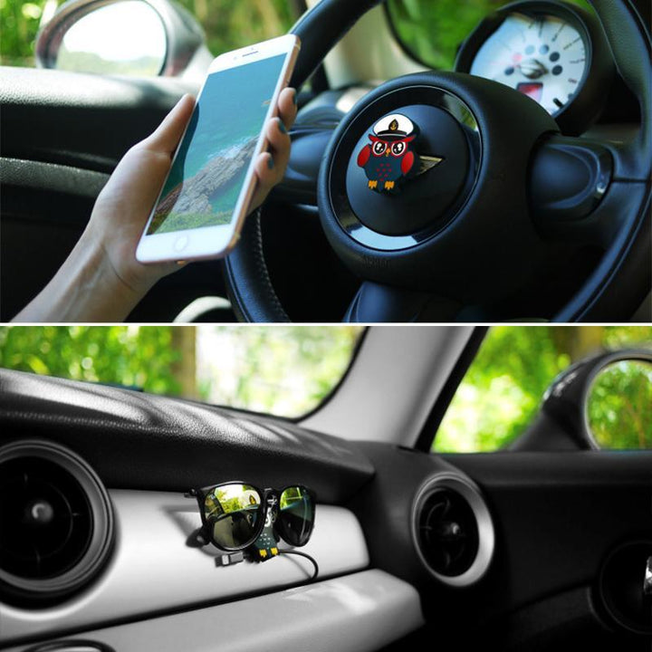 Compact magnetic phone holder in black, secures smartphone on desk or car, a versatile tech gadget.