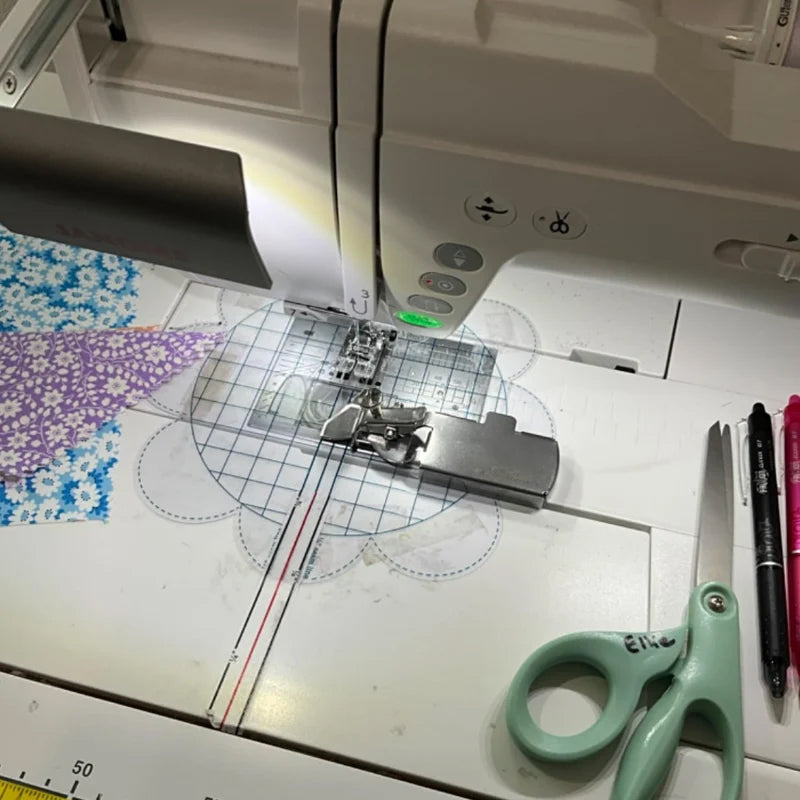 Close-up of magnetic sewing seam guide, showing strong magnet gripping machine bed for accurate fabric guidance.
