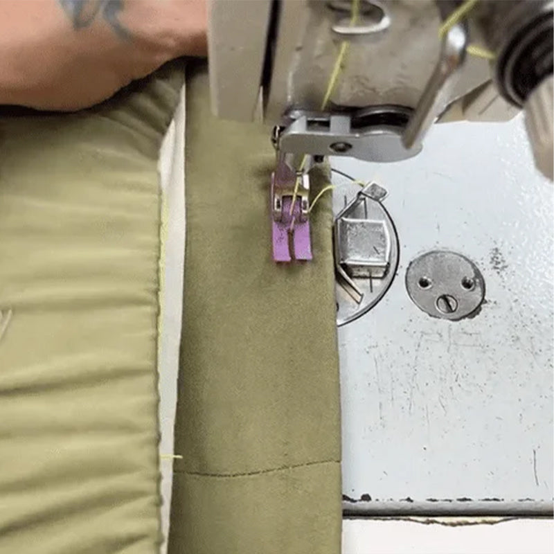 Hands demonstrating use of universal magnetic seam guide on a sewing machine for consistent seam allowances.