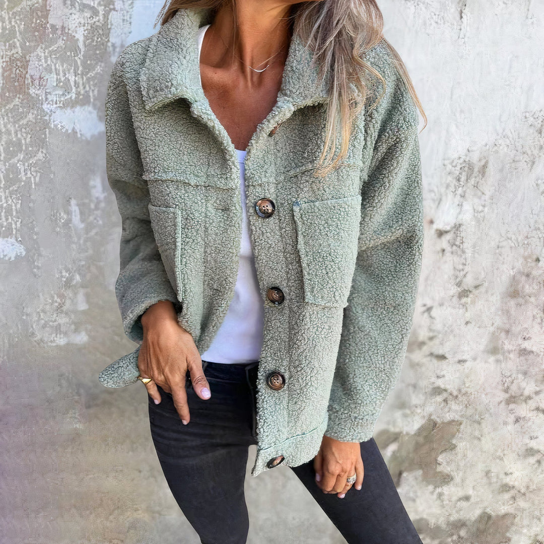 Marisol women's plush teddy winter jacket. Cozy, stylish long-sleeve coat with button closure, perfect for cold weather.