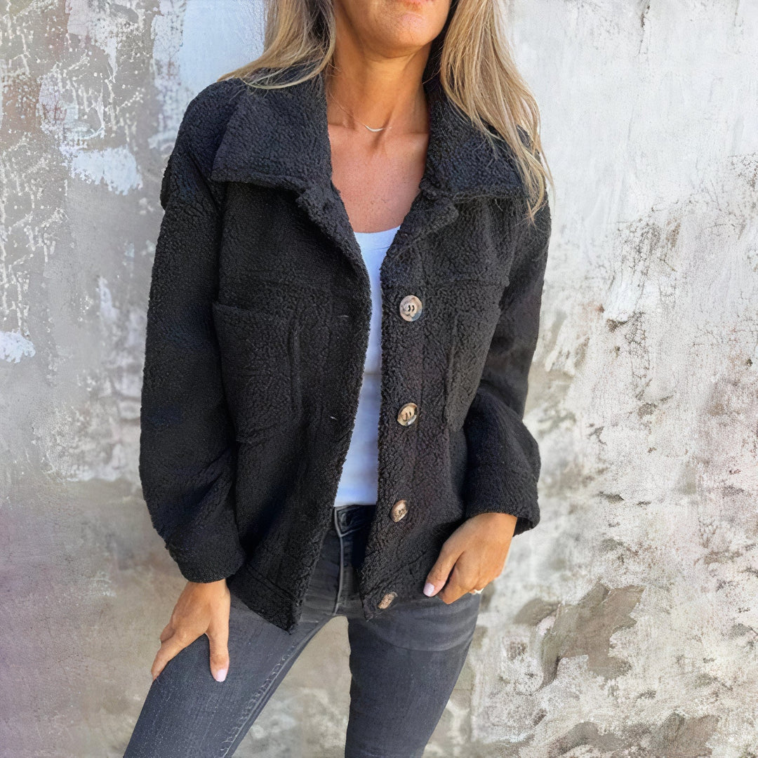 Fashionable women's plush long-sleeve winter jacket. Marisol short coat with button closure for cozy casual style.