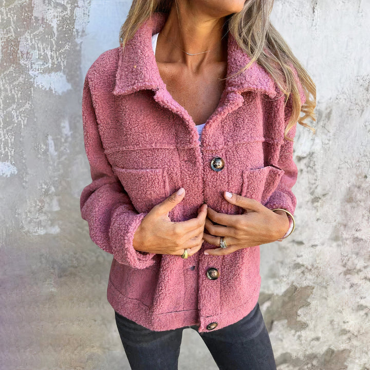 Soft teddy material women's autumn & winter coat. Plush Marisol short jacket with button closure for comfort and warmth.