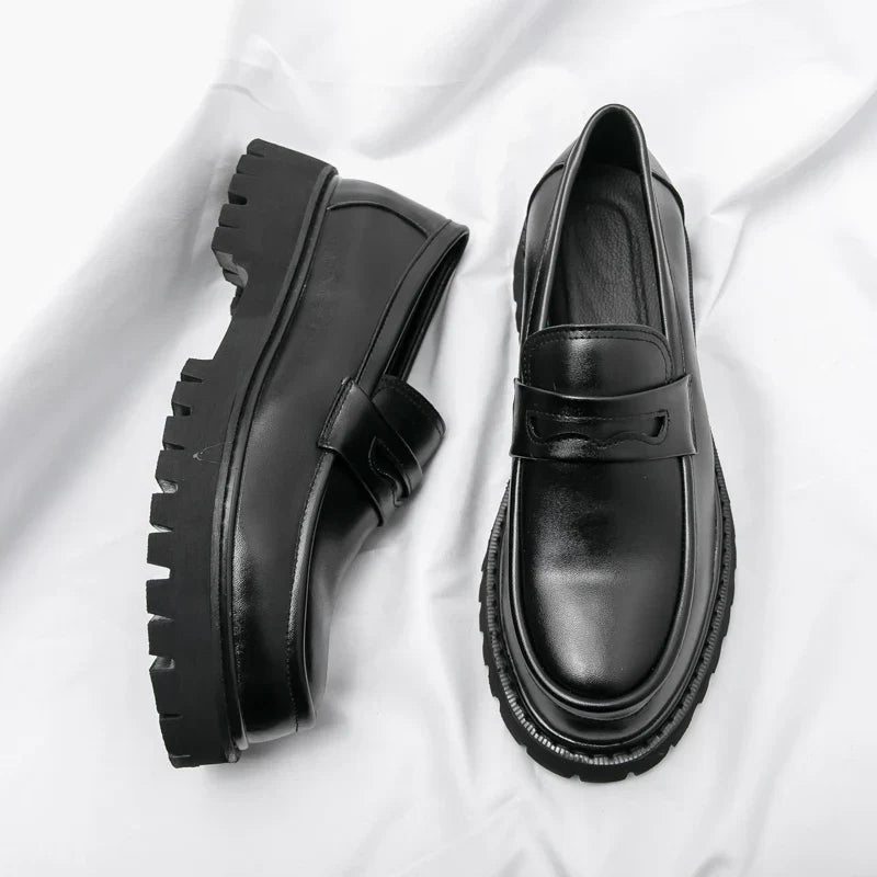 Men's black chunky sole loafers. Modern slip-on dress shoes for a sharp and versatile look.