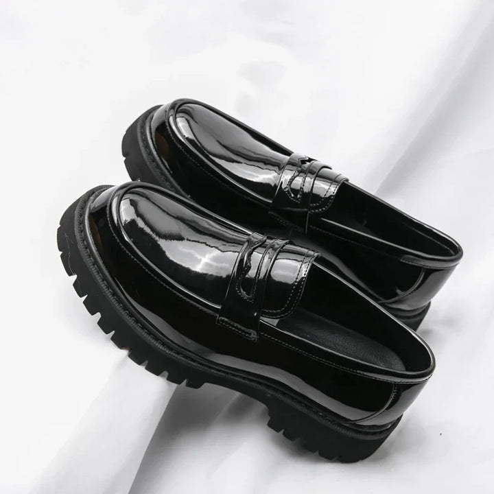 Stylish men's black slip-on loafers with chunky sole. Comfortable, modern fashion footwear for any occasion.