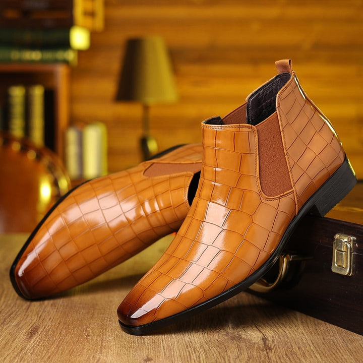 Luxe men's croc embossed Chelsea boots. Sleek, comfortable design with durable, slip-resistant sole.