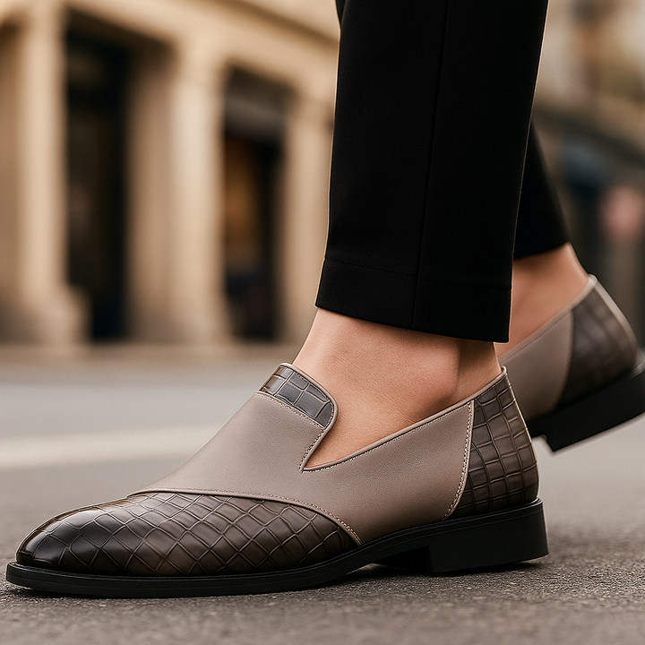 Pair of grey textured slip-on loafers for men, offering comfort and a modern business casual look.