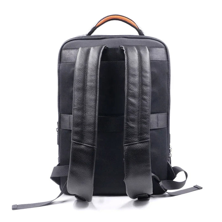 Stylish men's leather anti-theft backpack. Secure your essentials with a fingerprint lock for work, travel, or daily use.
