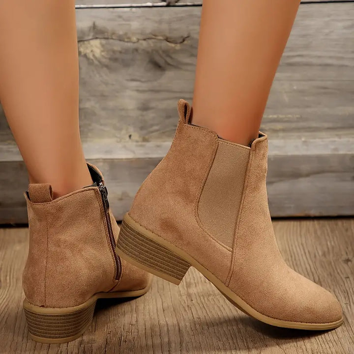 Classic men's leather Chelsea dress boots, sleek pull-on design, ideal for sophisticated everyday fashion.
