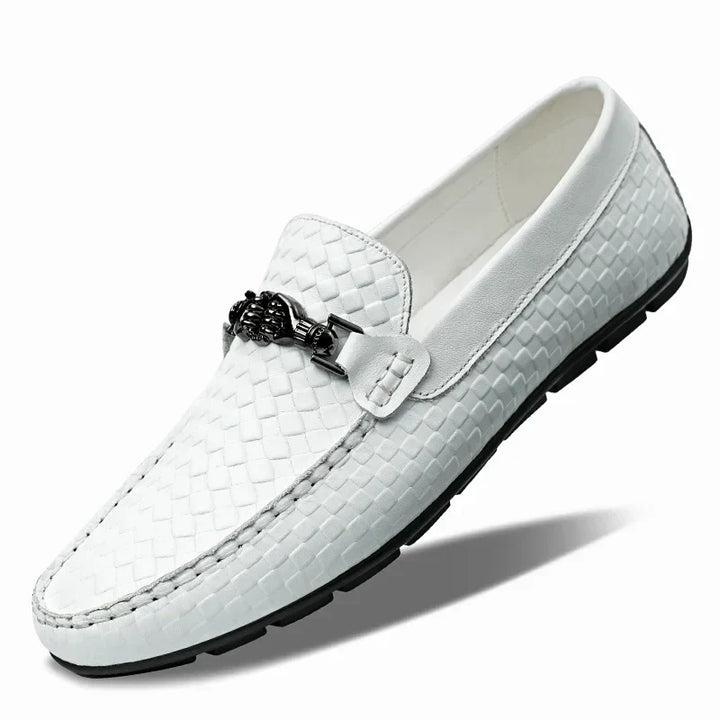 Studio shot of black men's grip loafers, showcasing their classic leather and slip-on style