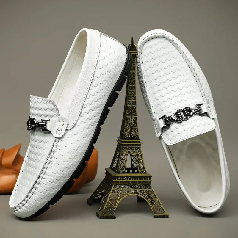 Side view of a black men's grip loafer, showcasing the classic dress shoe design