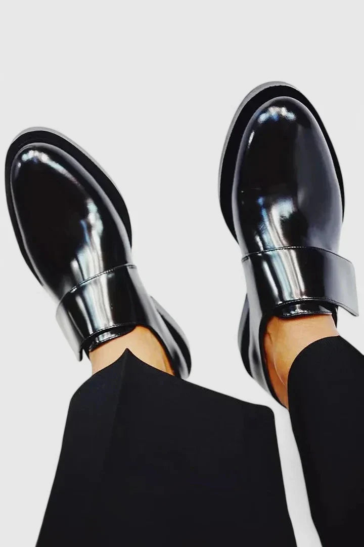 Comfortable men's black slip-on dress shoes, perfect for spring and summer casual wear.