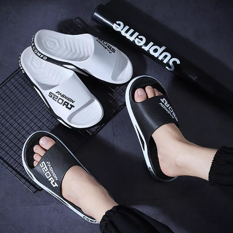 Lifestyle image of men's sport slide sandals worn with shorts, comfort sandals for men