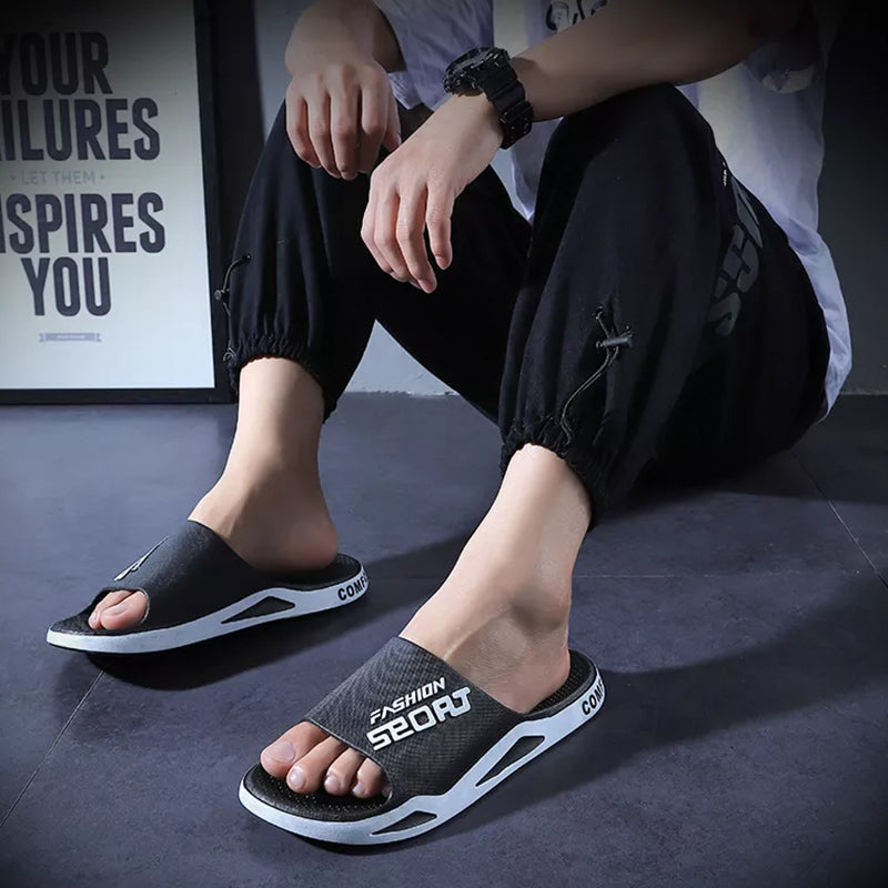 Bright orange men's sport slide sandals, adding a pop of color to outdoor footwear