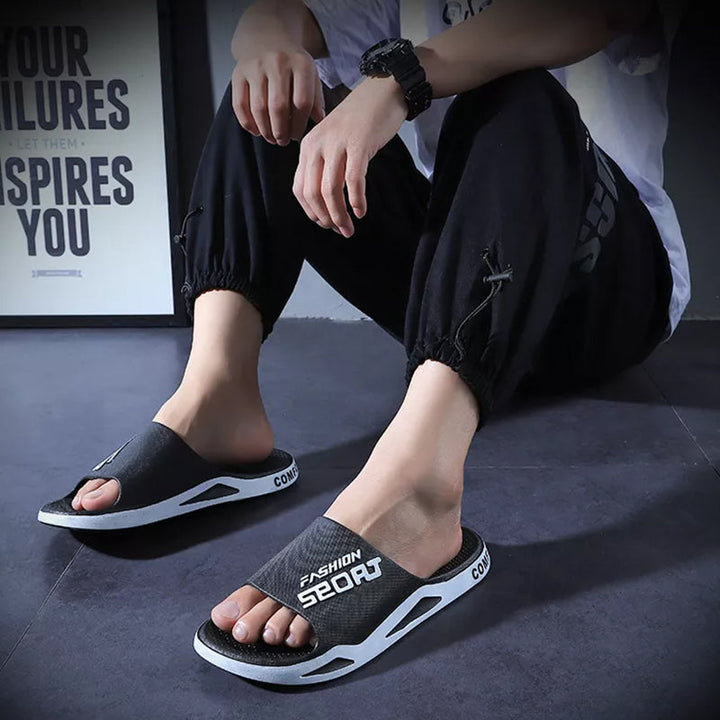 Bright orange men's sport slide sandals, adding a pop of color to outdoor footwear