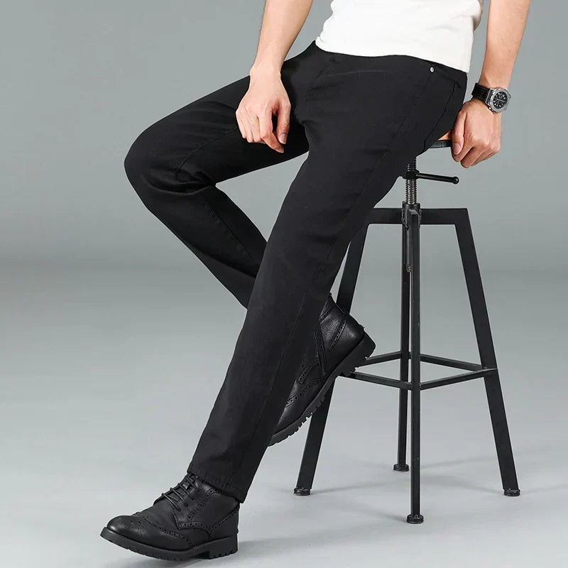 Durable men's black stretch jeans with a straight fit. Essential men's apparel for modern casual wear.