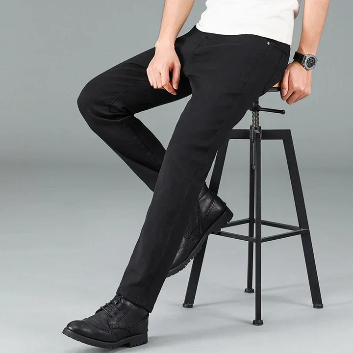Durable men's black stretch jeans with a straight fit. Essential men's apparel for modern casual wear.