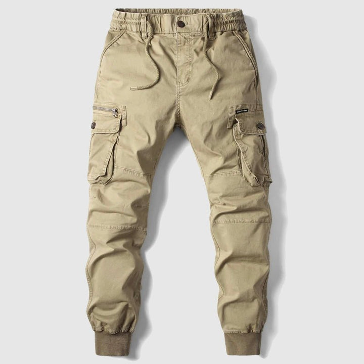 Men's black tactical cargo joggers, ideal for streetwear, featuring multiple utility pockets & elastic cuffs.