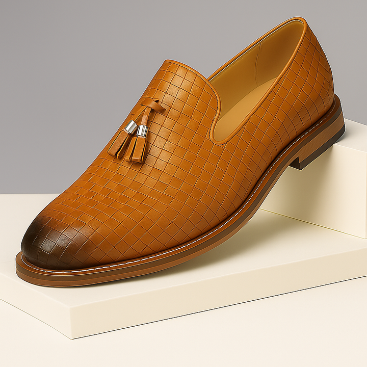 Close-up of men's leather tassel loafers with textured finish, ideal for dress occasions