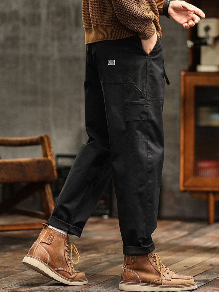 Practical men's multi-pocket utility pants in a vintage casual style, perfect for daily wear.