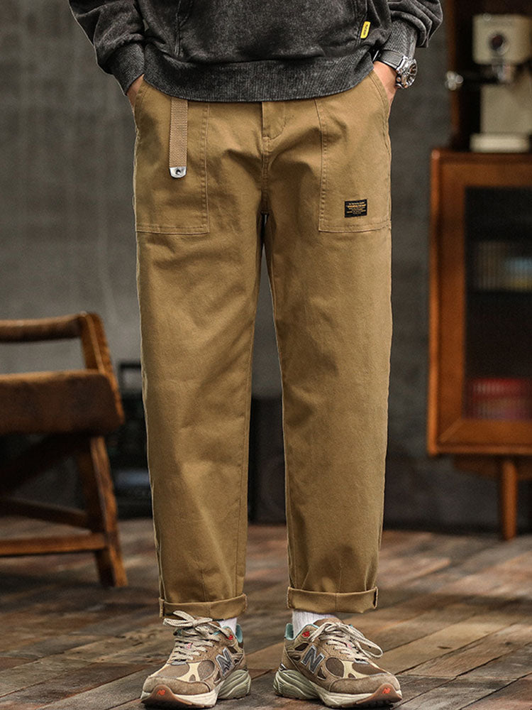Khaki men's multi-pocket vintage utility pants, relaxed fit, great for outdoor adventures.